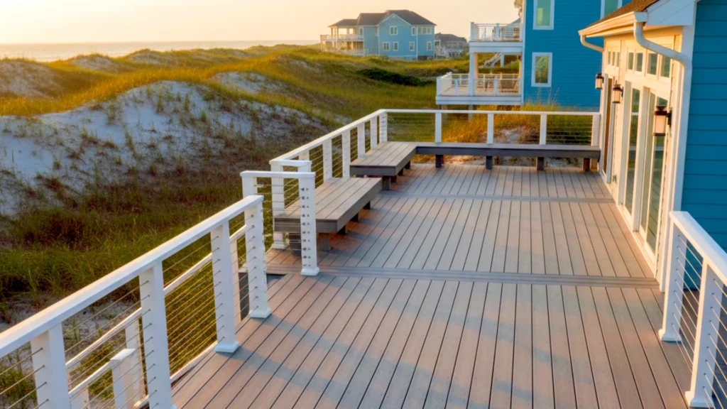Corolla NC coastal deck with cable railing and dune views showcasing durable materials built for Outer Banks wind and salt exposure.