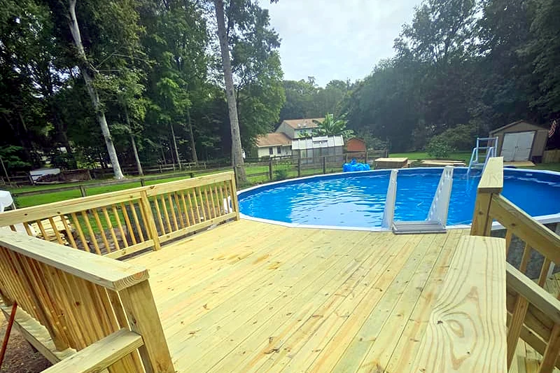 Backyard pool deck built by Curtis Bros. Contracting near Williamsburg, VA
