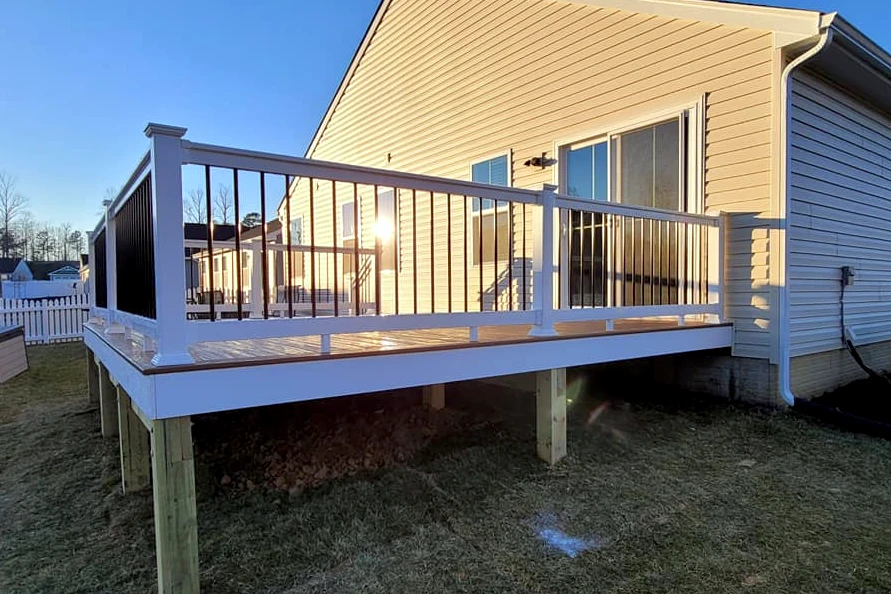 Custom deck with stairs and railings built by Curtis Bros. Contracting in Williamsburg, VA