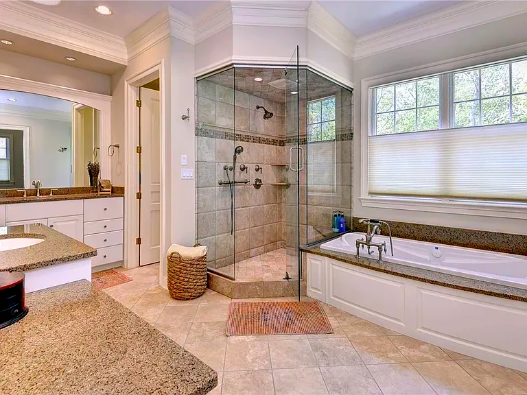 Finished bathroom remodel with glass shower, tub, vanity, and tile details for a Glen Allen, VA home