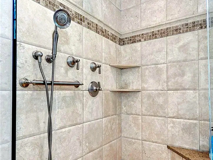Tub-to-shower conversion with updated shower fixtures and tile for a Manakin-Sabot, VA bathroom