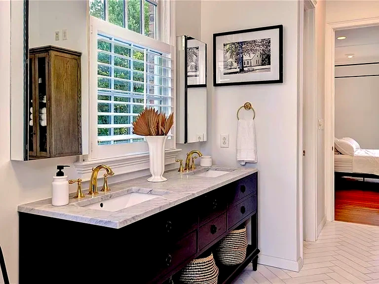 Bathroom vanity, fixtures, mirror, lighting, and storage upgrades for a Virginia Beach, VA home